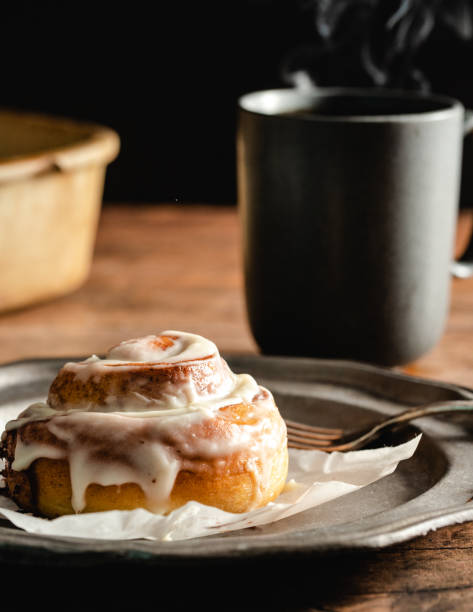 istock Fresh made  Cinnamon Bun and Coffee with steam 1396297279