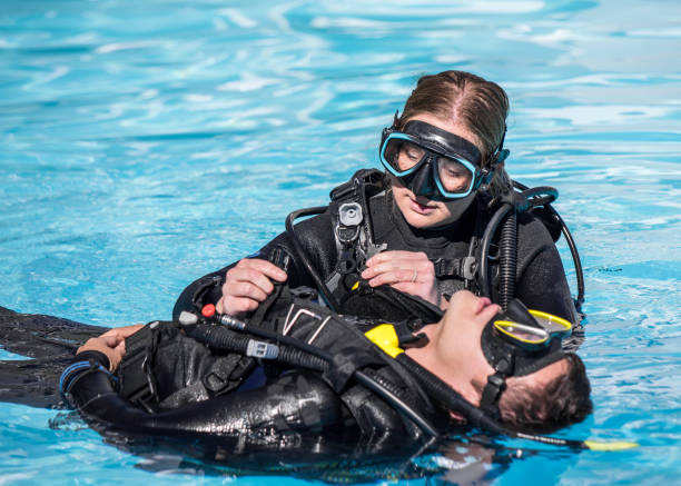 istock Scuba Diving rescue course surface skills removing gear 1396301492