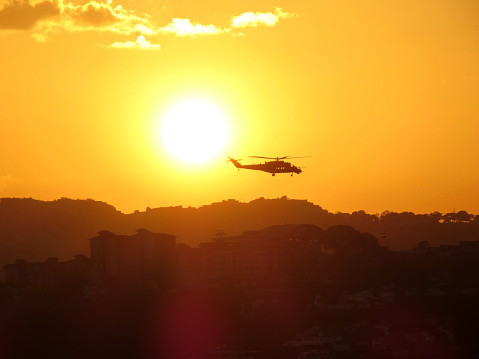 Mi-35M2 Caribe  helicopter flying low over Caracas in backlight the Julio 5 of 2021 in the framework of the independence parade of Venezuela