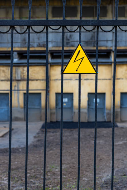 istock high voltage sign hanging on the fence 1396303598