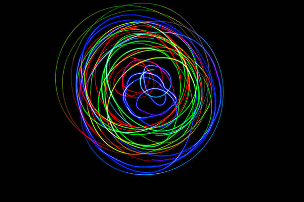 istock Color Light LED Bulb moving in the dark on long exposure shot 1396306886