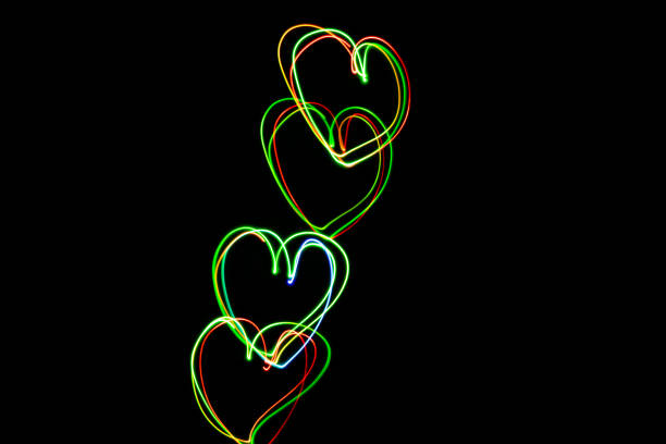 istock Color Light Moving Heart Shape in the dark on long exposure shot 1396306943