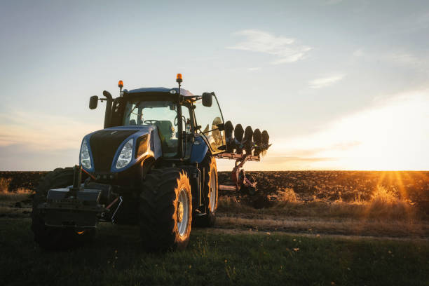 istock Tractor preparing land with seedbed cultivator 1396309403