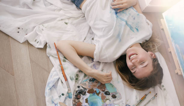 istock Young beautiful woman painter creating art work in studio. 1396309830
