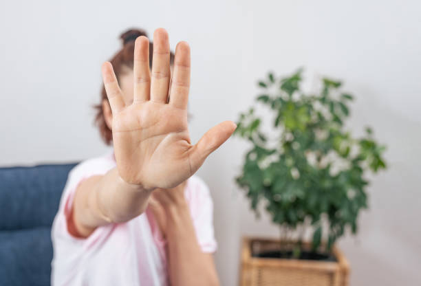 istock Woman showing stop gesture with hand 1396312263