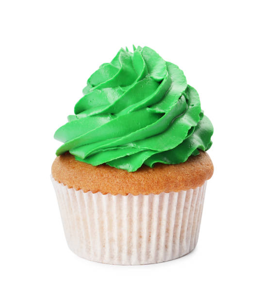 istock Delicious cupcake with green cream isolated on white 1396316027