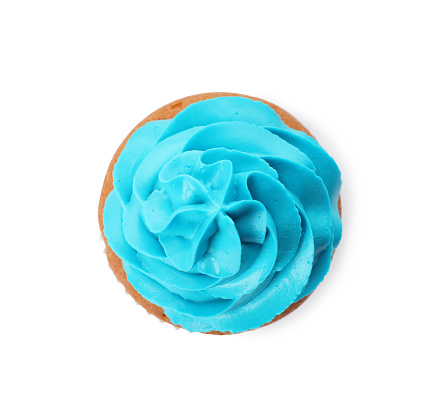 Delicious cupcake with light blue cream isolated on white, top view
