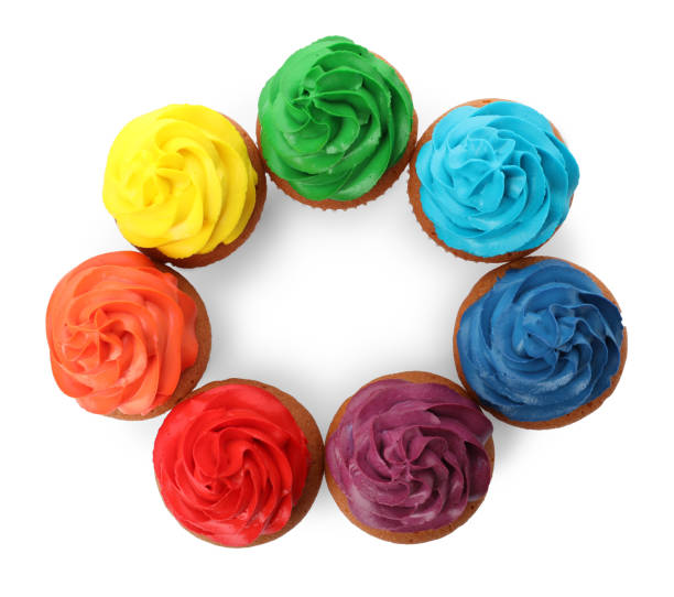 istock Different delicious colorful cupcakes on white background, top view 1396316595