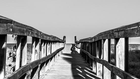 Boardwalk bridges between inland and beach, leads to the ocean. Amelia Island, Florida, USA