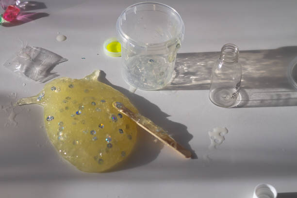 istock Yellow Slime with silver sequins made by children themselves from ingredients 1396316834