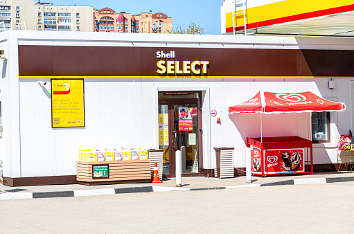 Samara, Russia - May 07, 2022: Shell Select storefront at Shell gas station. Royal Dutch Shell is an Anglo-Dutch multinational oil and gas company