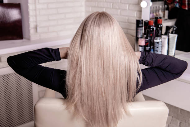 Female back with long, straight, blonde hair