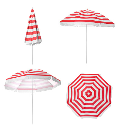 Set with striped beach umbrellas on white background
