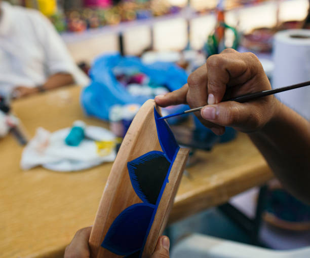 istock mexican artist painting pottery 1396318799