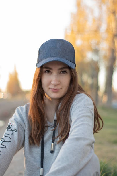 istock Red-haired girl with blue cap 1396319693