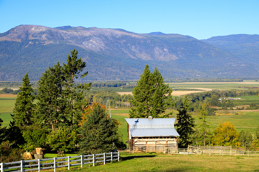 Canadian agricultural landscape  of farmland and agriculture in the Creston Valley located in the Kootenay regiion near Creston, British Columbia, Canada.