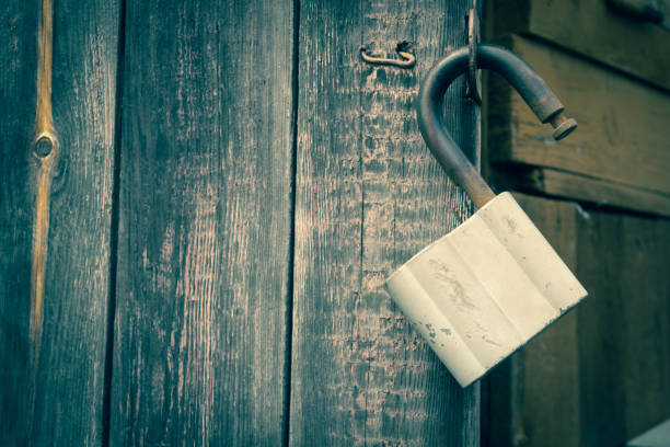 Old Wooden Doors Locked By Rusty Padlock Stock Photos, Pictures &  Royalty-Free Images - iStock