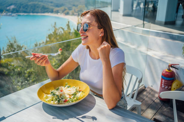 istock Woman enjoying lunch with beautiful view 1396326137