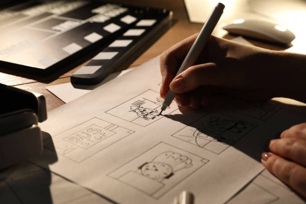 istock Woman drawing cartoon sketches at workplace, closeup. Pre-production process 1396327366