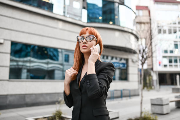 istock Beautiful Businesswoman Having Phone Call During Work Break Outside 1396328558