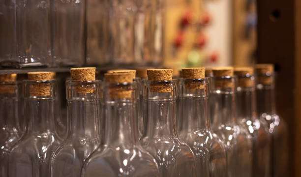 istock Close-up, empty glass bottles with corks on a blurred background. 1396328829