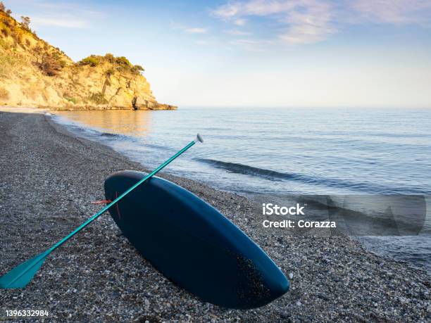 Surfboard With Paddle Stock Photo - Download Image Now - Maro - Costa Del Sol, Paddleboat, Surfing