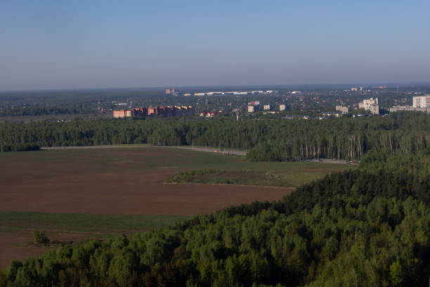 istock bird's eye view of the city forest and fields 1396333372
