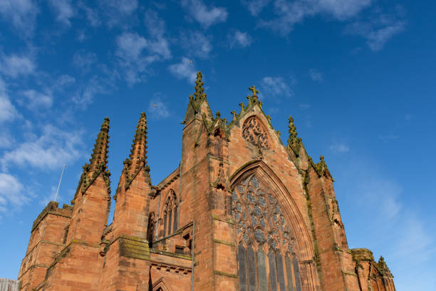 Carlisle Cathedral in the spring sunshine.  The second smallest of England's ancient cathedrals it was founded as an Augustinian priory and became a cathedral in 1133.  Carlisle, Cumbria, UK.