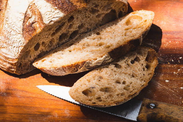 istock bread slices cut from artisan baked and decorated round loaf 1396334837