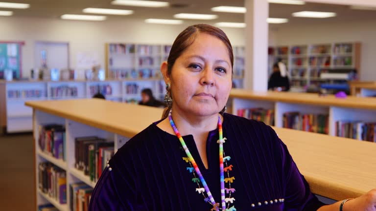 High School Teacher in a Library