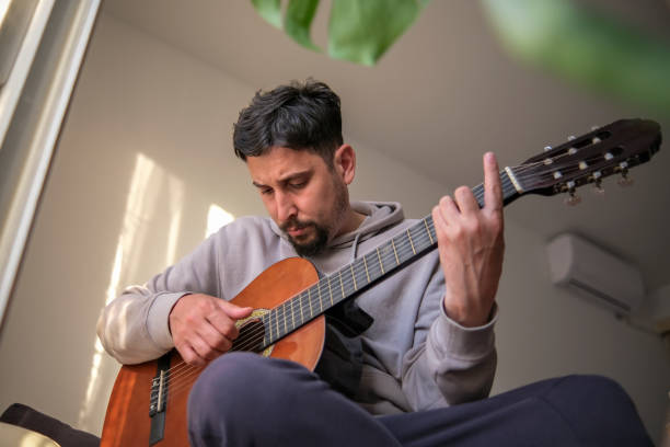 istock Slowly learning the chords of my favorite song 1396335976