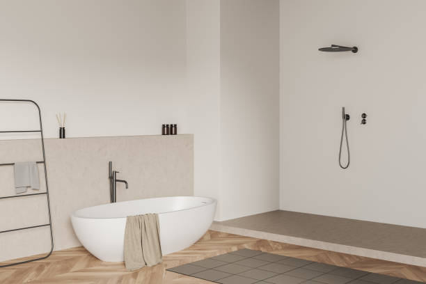 istock Light bathroom interior with tub, shower and rail ladder 1396339130