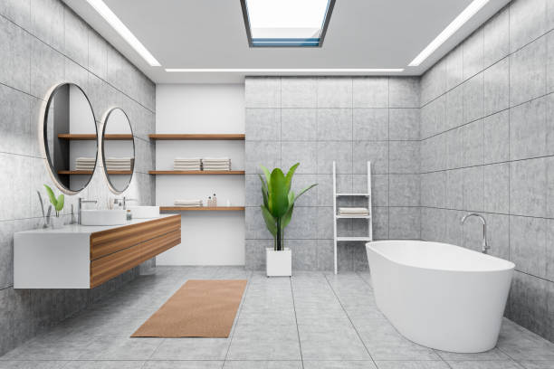 istock Front view on bright bathroom interior with bathtub, round mirrors 1396341623