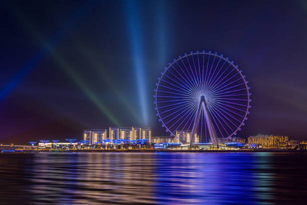 Amazing night view to the Ain Dubai, giant Ferris at Bluewaters Island close to JBR beach, world's largest observation wheel, fits perfect to modern UAE skyline. Ain Dubai or Dubai Eye, at Bluewaters manmade Island in the United Arab Emirates, is the world’s tallest and largest observation wheel, with a height of over 250 m. The wheel opened on 21 October 2021. dubai island stock pictures, royalty-free photos & images