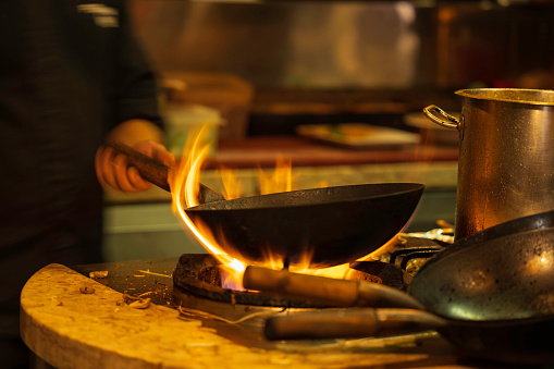 old frying pan on fire in the restaurant