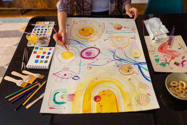 istock Woman drawing with colors on the paper 1396346441