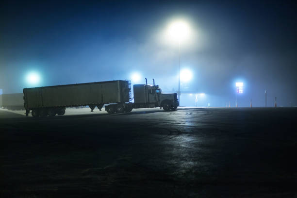 istock Foggy Midnight Semi Trailer Truck Expressway Rest Stop 1396351812