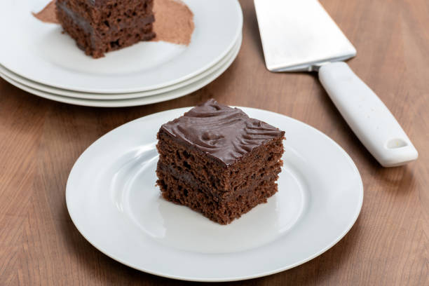 istock slice of chocolate cake covered with chocolate, served chilled, 1396352579