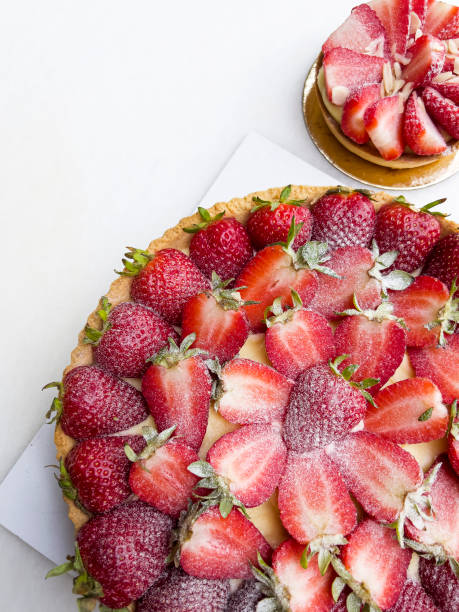Home made delicious strawberry tart over white background