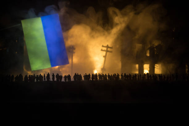 istock Creative artwork decoration war on Ukraine. Crowd looking on giant explosion and attacking soldiers. 1396354186