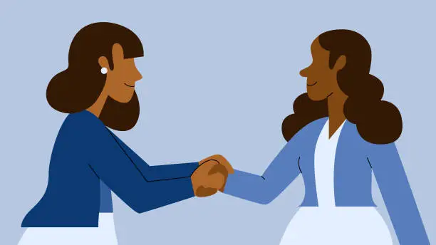 Vector illustration of Two Multiracial Businesswomen Shake Hands Connecting and Networking while Smiling
