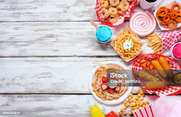 Carnival Theme Food Side Border Over A White Wood Background Stock Photo - Download Image Now