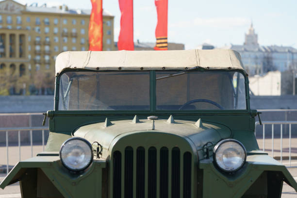 Moscow, Russia - May 5, 2022: Military vehicle. Historical heritage theme of the soviet World War 2 time. Close up photography. Translation of the inscription in Russian on the flag - Victory. Close up photography