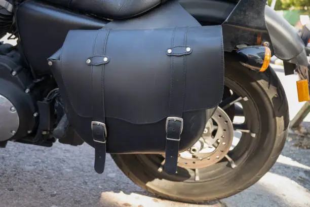 Leather vintage  black saddlebags for Harley in the side back of the motorbike to keep the luggage to go to an exhibition