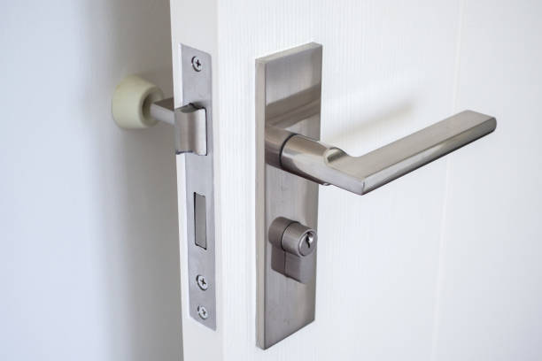 istock Wall mounted door stopper with modern door handle 1396361482