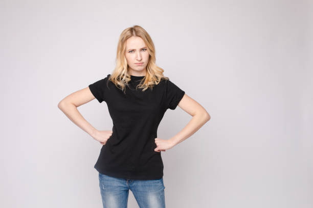 istock Angry or sad girl with folded arms. 1396361565