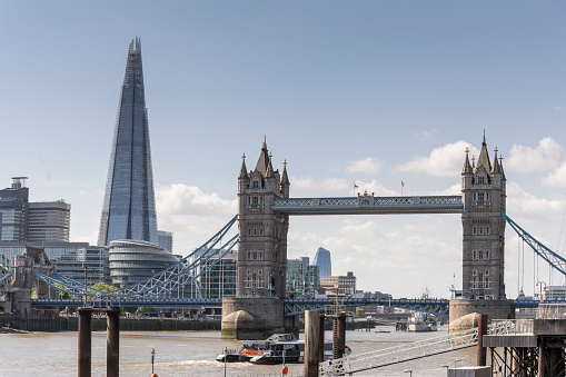 A view of the Tower Bridge, Shard and the Thames in London on a sunny spring day.