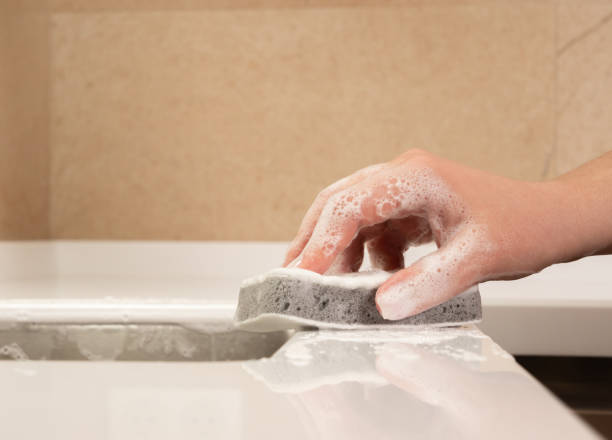 istock close-up of a hand with a sponge and foam while cleaning 1396367205