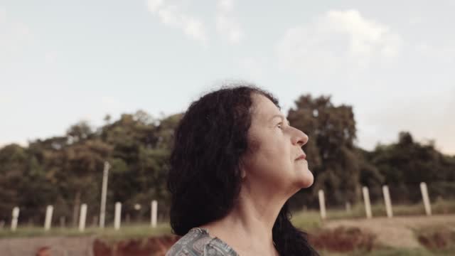 Smiling latin Brazilian woman in the farm. Joy, positive and love. Cinematic 4K