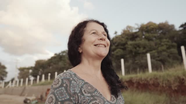 Smiling latin Brazilian woman in the farm. Joy, positive and love. Cinematic 4K